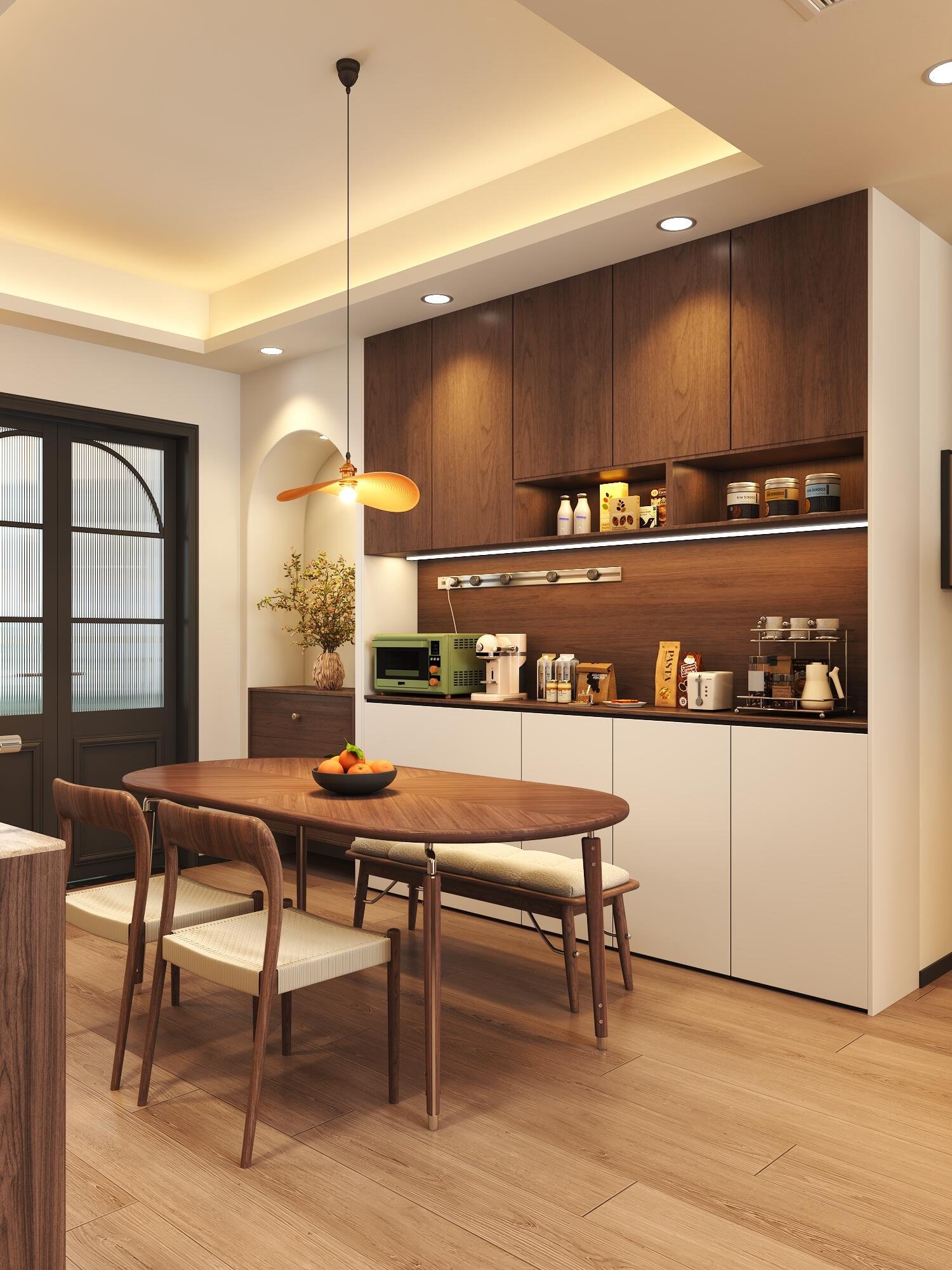 Cozy kitchen and dining space with cream walls, wood textures, and layered lighting