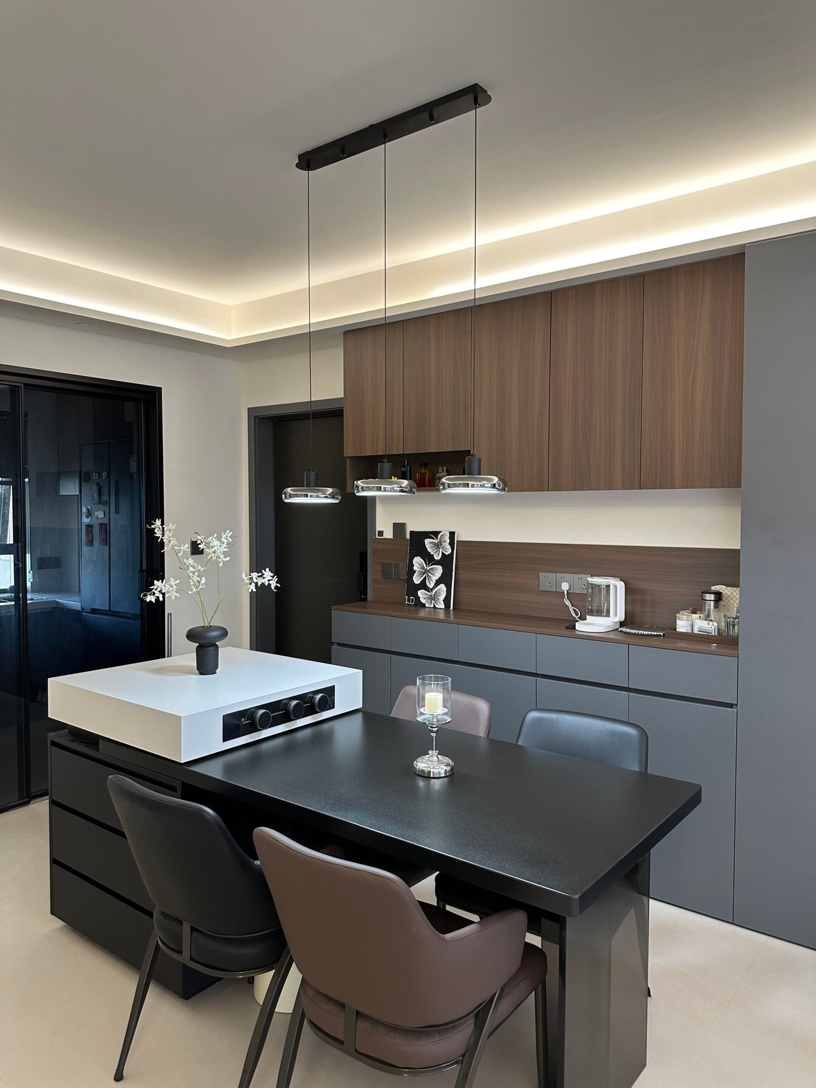 Modern Dining Table Set for 4 with black table and walnut cabinetry.