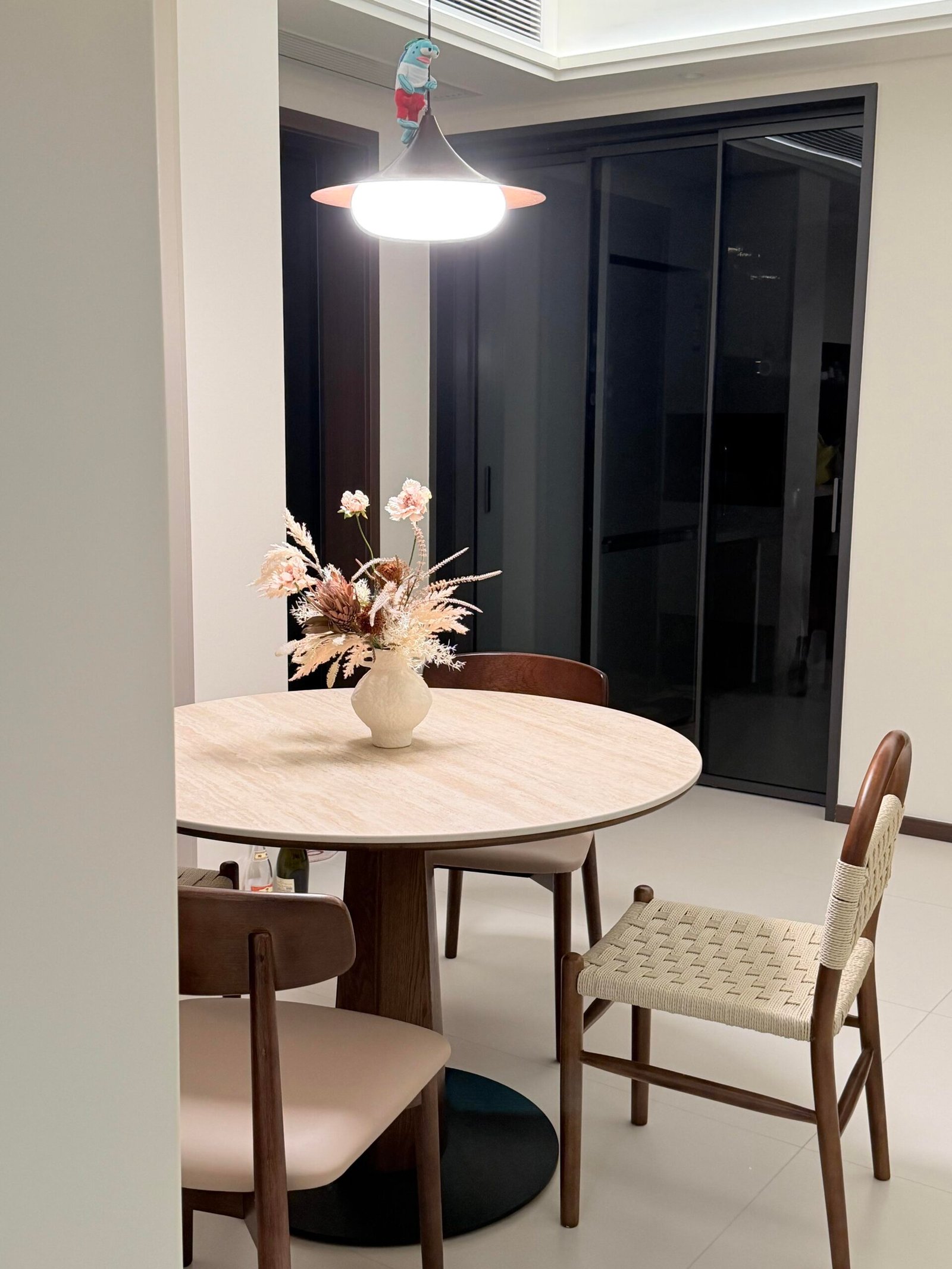 Stylish Dining Table Set for 4 with woven seating and soft neutral decor.
