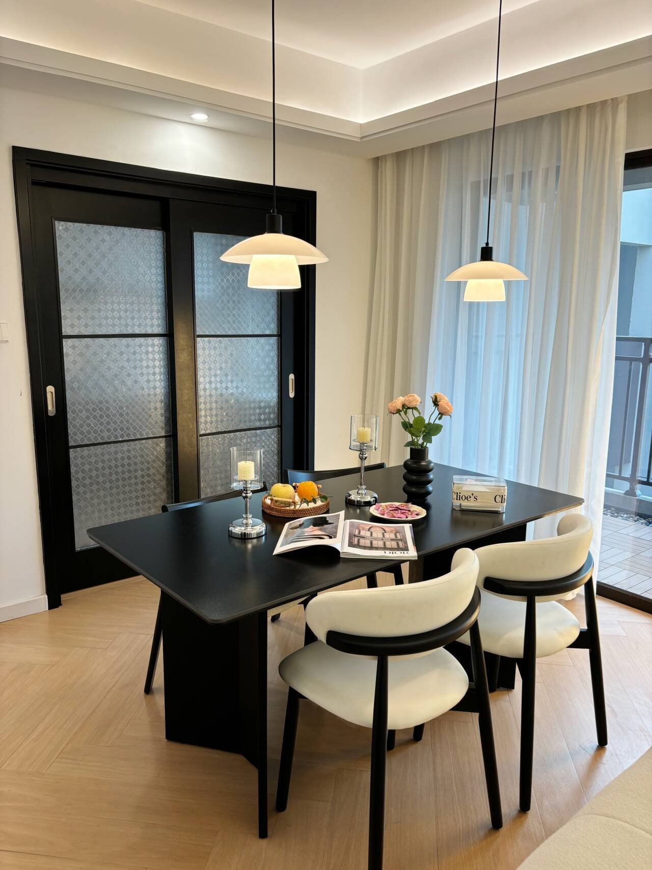 Modern Dining Table for 4 with elegant pendant lights and cream dining chairs
