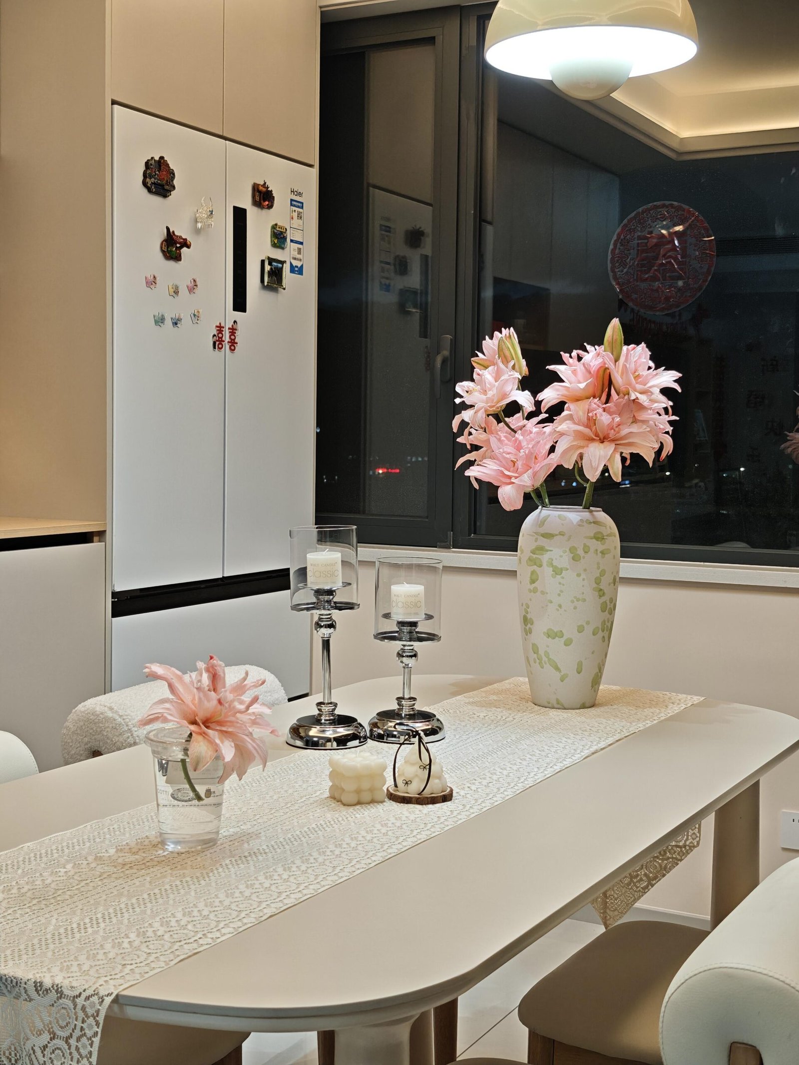 Contemporary dining room with white walls, wood accents, and luxury finishes