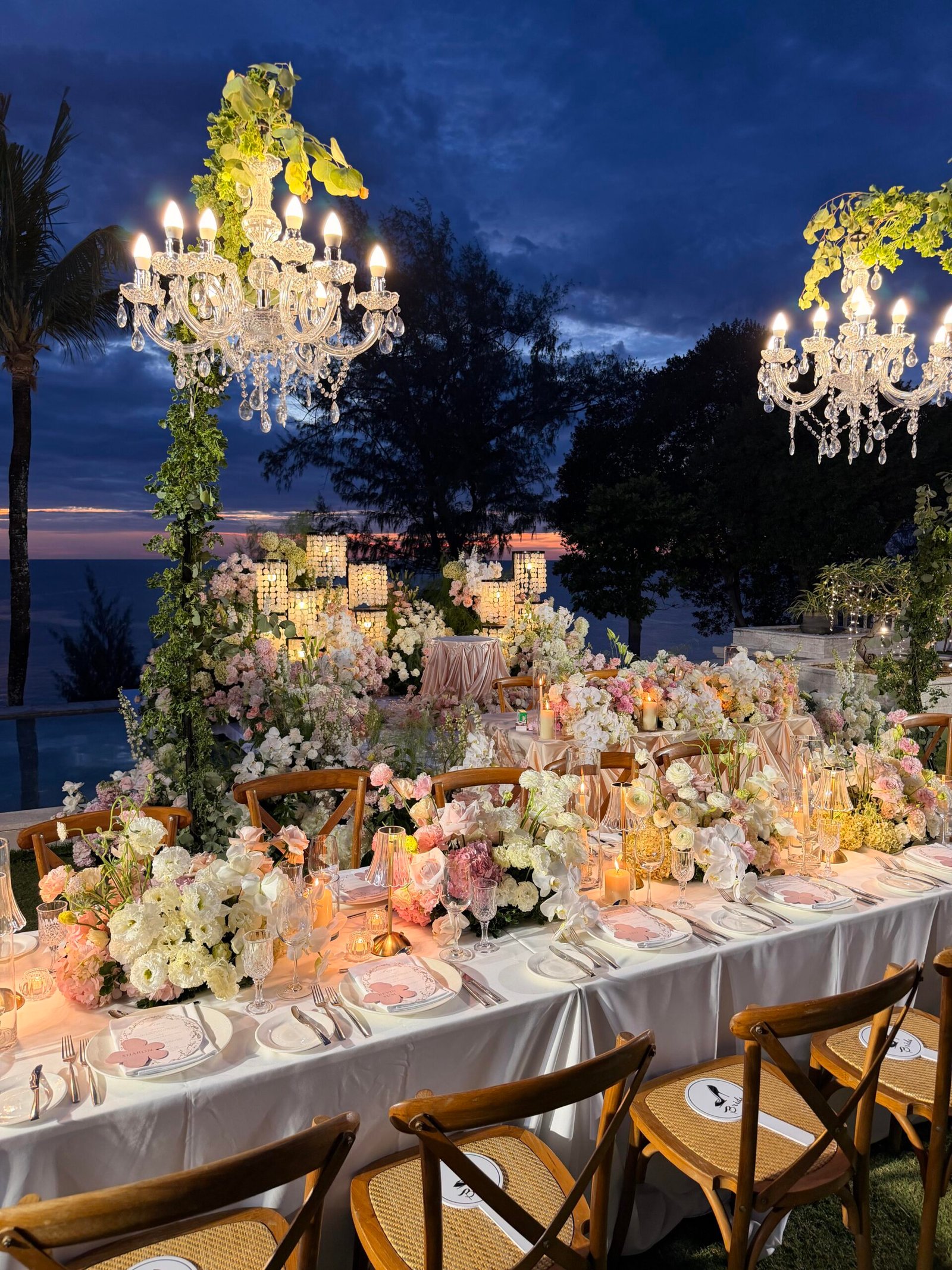 Floral moon gate arch with cascading blush roses and greenery